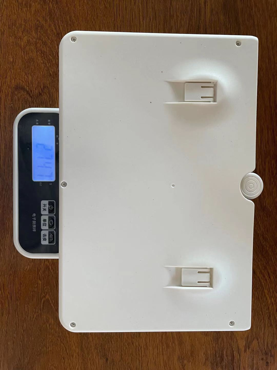 White electronic device with ports on a wooden surface